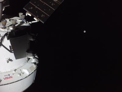 Orion with distant Moon